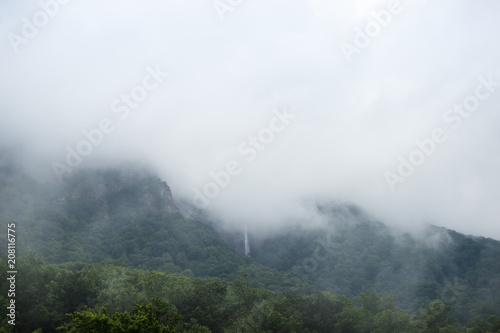 High waterfalls. Mountains in the clouds. Chimney rock, NC, USA