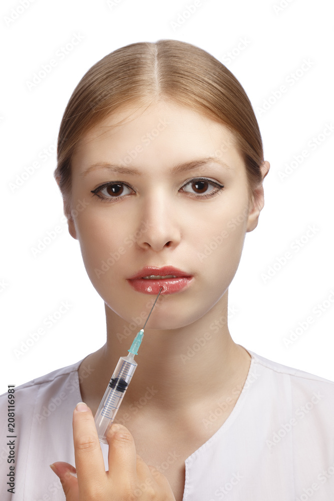 Lips plastic surgery injection on young woman face Lips plastic surgery injection on young woman face