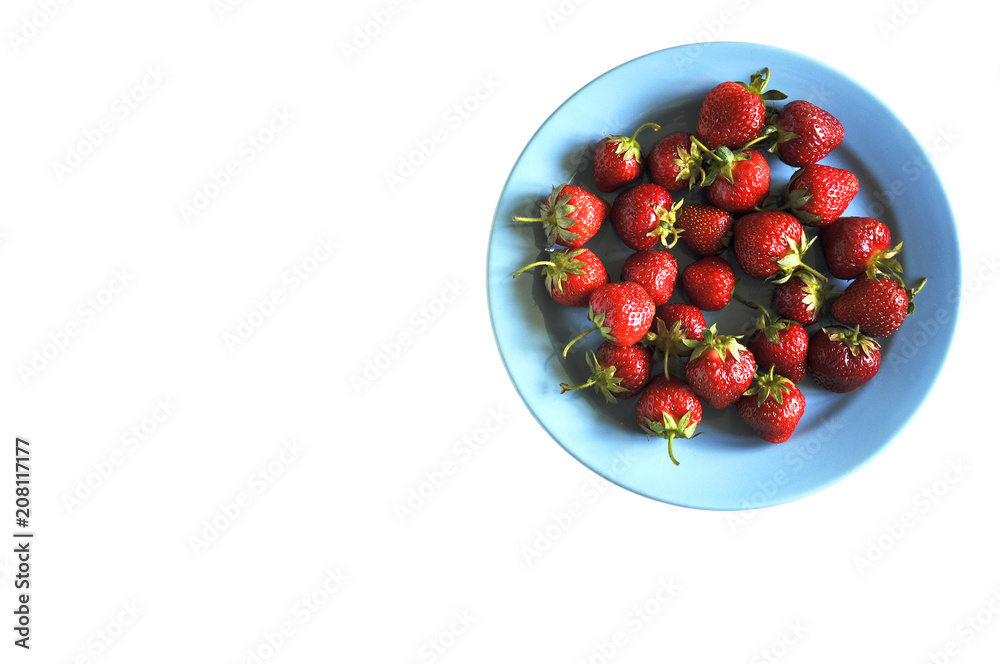 Strawberry in plate on white background close-up Strawberry in plate on white background close-up