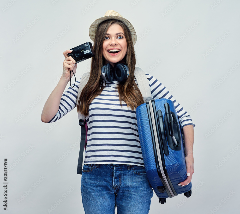 Woman traveler holding camera and travel suitcase. Woman traveler holding camera and travel suitcase.