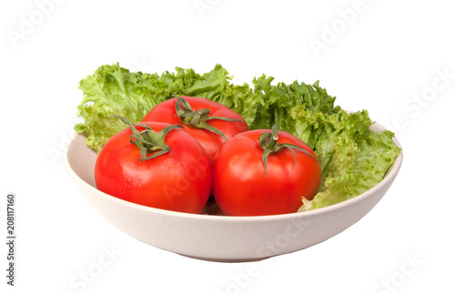 tomatoes with lettuce on dish isolated on the white