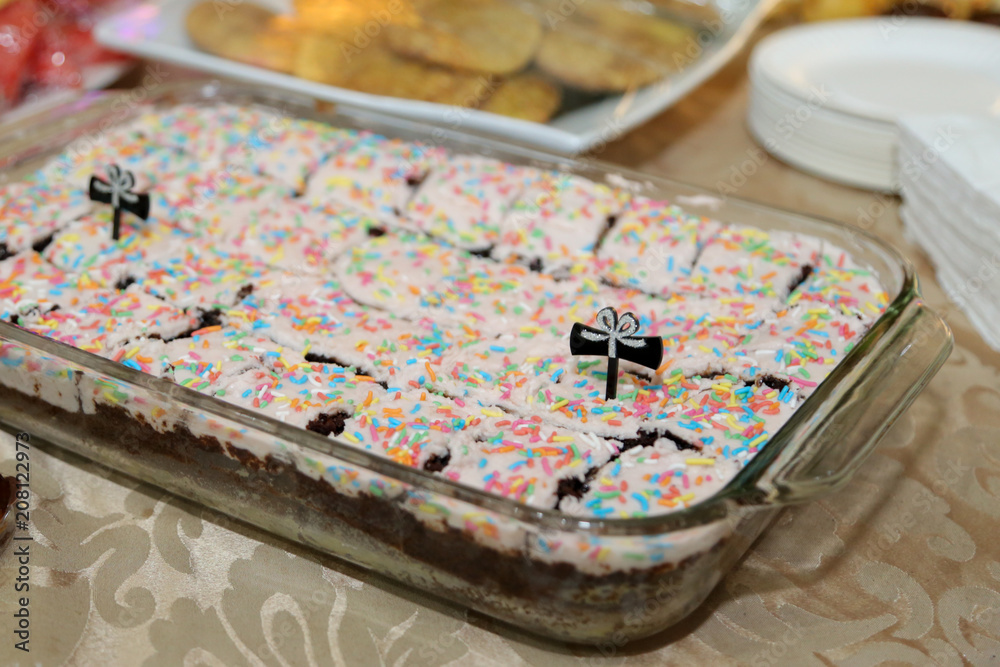 Chocolate brownies cake with sprinkled colorful chocolate rice and festive sprinkles. Chocolate brownies cake with sprinkled colorful chocolate rice and festive sprinkles.