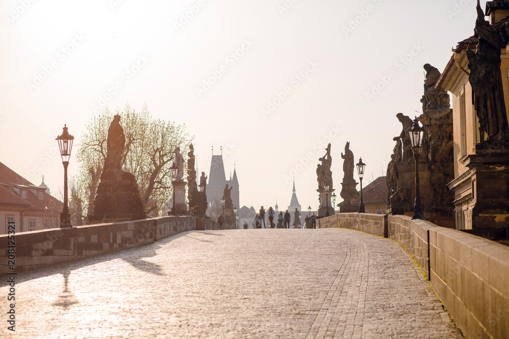 Obraz premium Empty Charles bridge with sculptures in the morning, sunset in Prague, Czech Republic