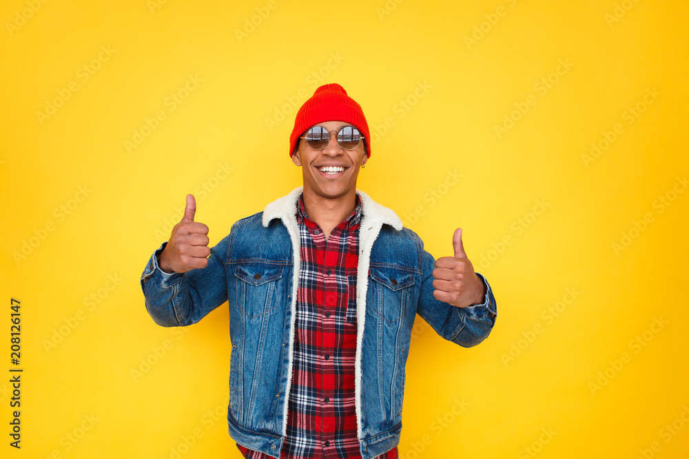 Happy black man holding thumbs up