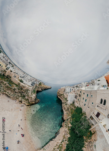 Old white city near blue the Sea Polignano Apulia Coastline blue in Italy Drone 360 vr photo