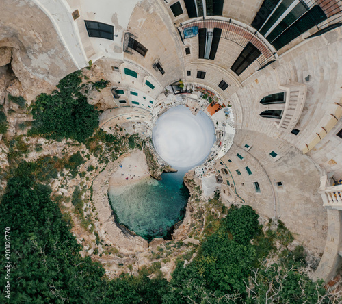 Old white city near blue the Sea Polignano Apulia Coastline blue in Italy Drone 360 vr photo