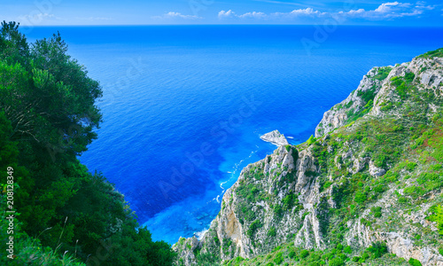 Beautiful summer seascape. Awesome view of the picturesque green hill coastline sea bay with crystal clear azure water in the calm warm Mediterranean sea. Outskirts Paleokastrica. Corfu. Greece.
