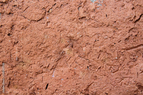 Wall covered with clay close-up. Plaster. Texture. Background.