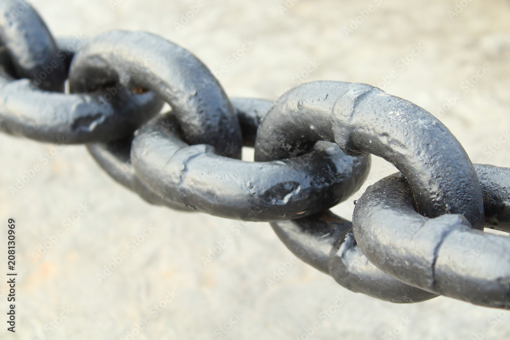Black thick steel chain. Chain for fencing. Close-up. Background. Black thick steel chain. Chain for fencing. Close-up. Background.