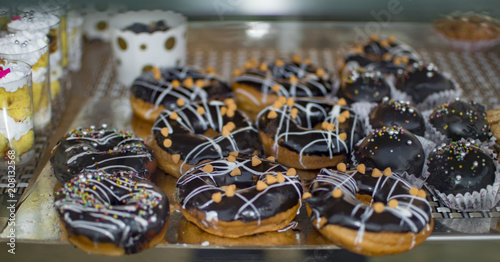 Chocolate doughnuts on tray for sale
