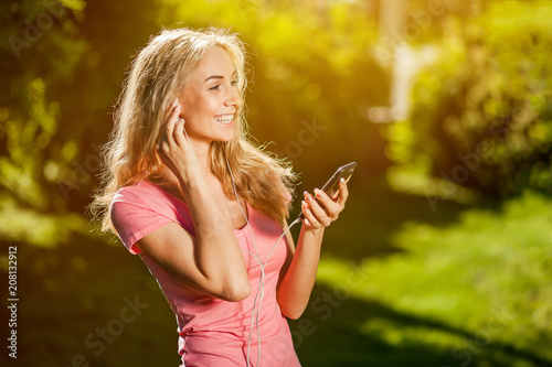 girl talking on the phone in a Sunny Park