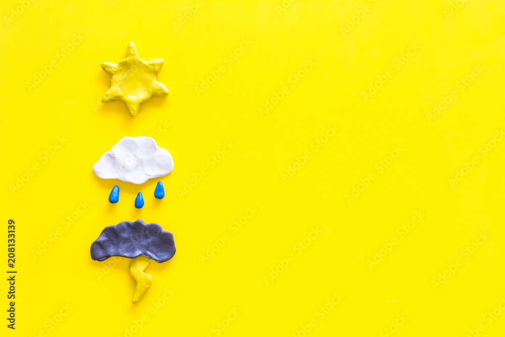Weather forecast concept. Modern weather icons set on yellow background top view copy space - obrazy, fototapety, plakaty 