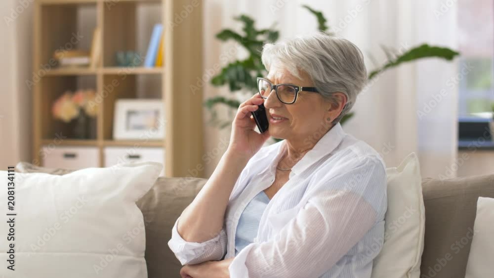 technology, communication and people concept - happy senior woman calling on smartphone at home technology, communication and people concept - happy senior woman calling on smartphone at home