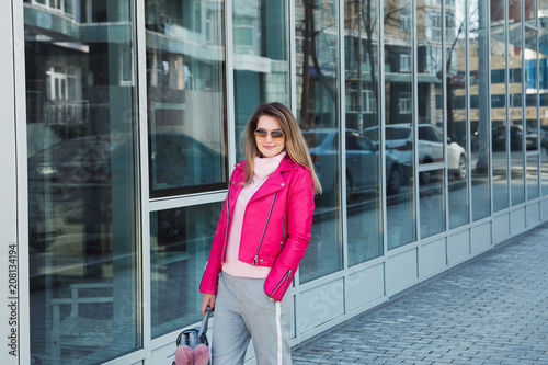 attractive girl pink leather jacket posing outdoor