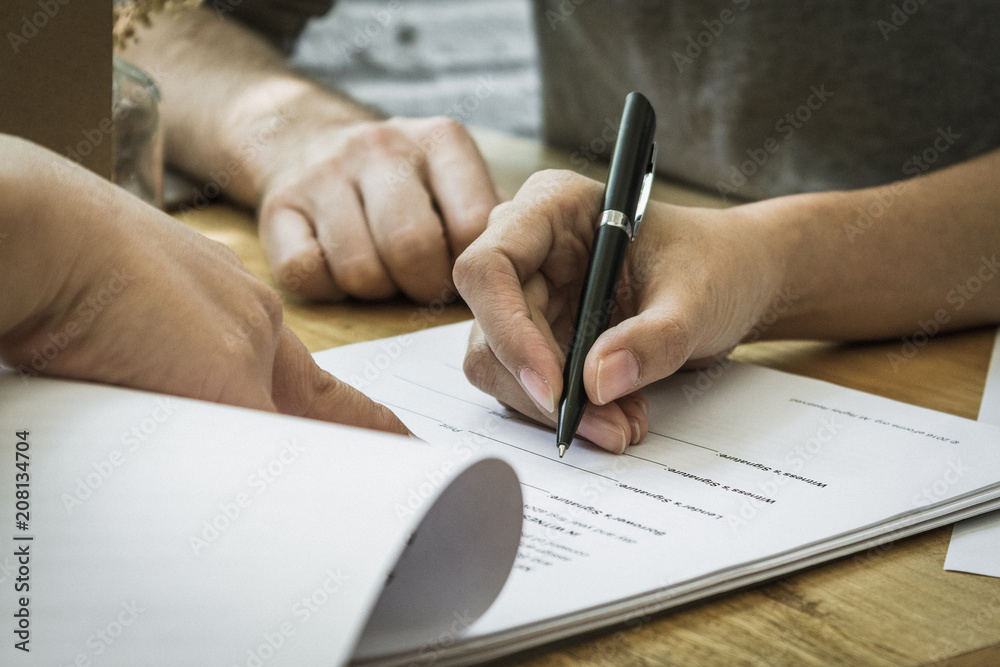 Contract signature for business and financial contract. Sign on the dotted line. Male caucasian pen signs a paper. Contract signature for business and financial contract. Sign on the dotted line. Male caucasian pen signs a paper.