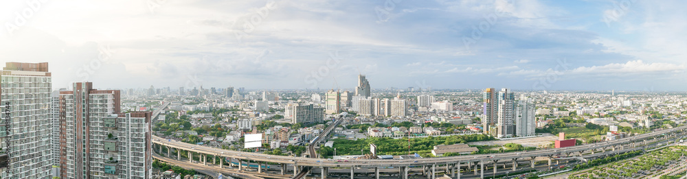 Obraz premium Aerial view of city, Landscape of Bangkok city skyline in Aerial view with skyscraper, modern office building and blue sky with cloudy sky background in Bangna Bangkok, Thailand.