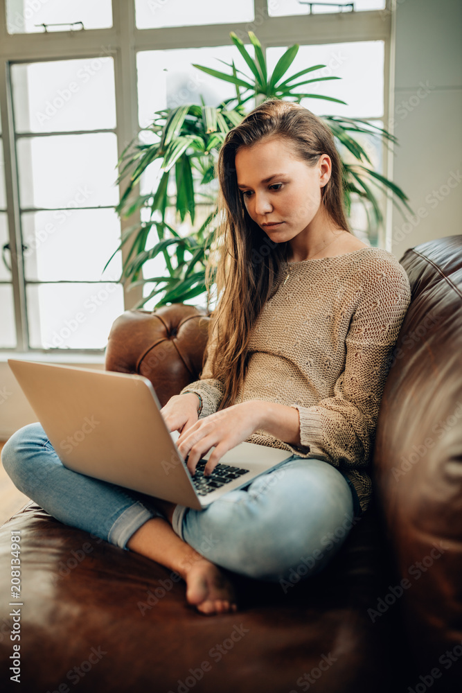 Woman working on laptop computer