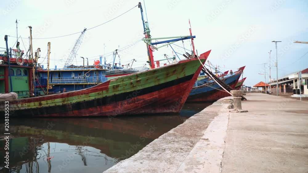 Old rusty boats pier in Pekalongan, Java, Indonesia Old rusty boats pier in Pekalongan, Java, Indonesia