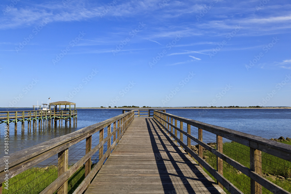 Wood boardwalk at Waterfront Park in Southport, North Carolina in the summer Wood boardwalk at Waterfront Park in Southport, North Carolina in the summer