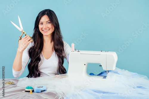 Dressmaker With Sewing Machine In Her Studio Stock Photo, Picture and  Royalty Free Image. Image 10929249.
