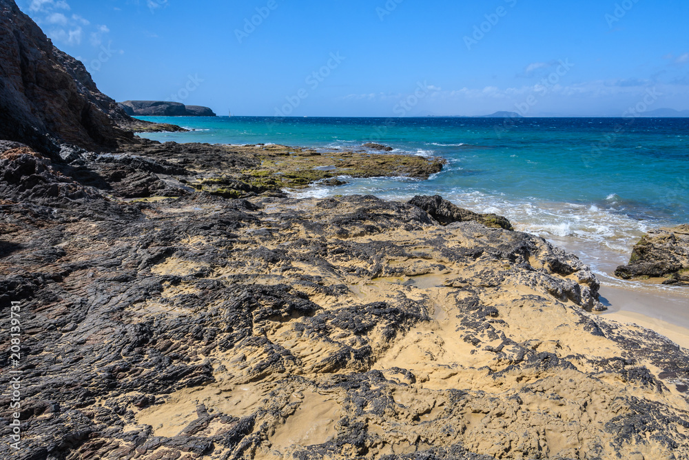 Secluded beach in the Papagayo Coast in Lanzarote, Spain