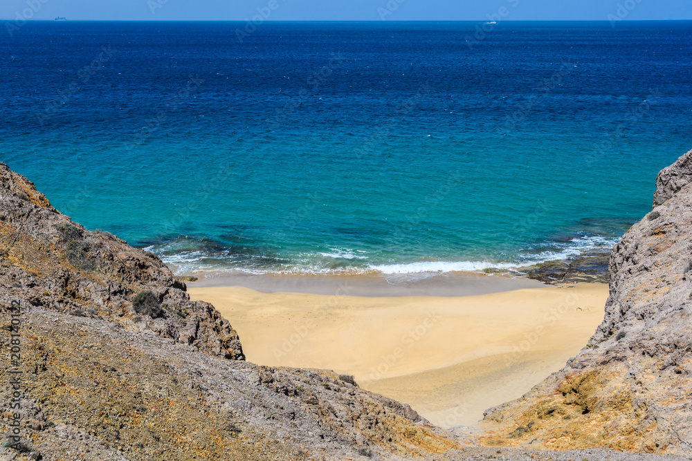 Secluded beach in the Papagayo Coast in Lanzarote, Spain
