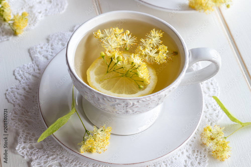 A cup of herbal tea with linden flowers A cup of herbal tea with linden flowers