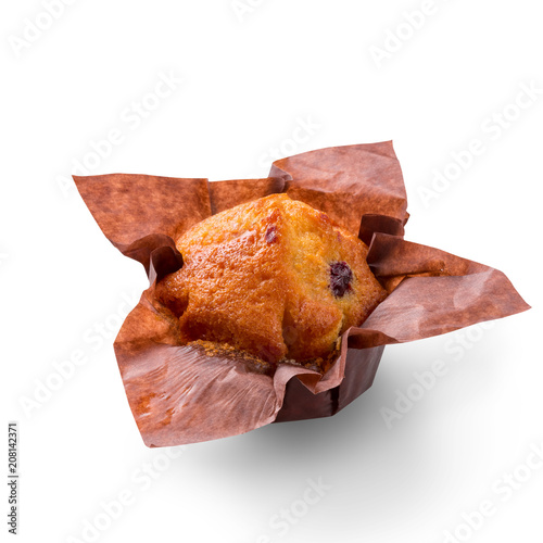 Delicious muffin on white background. Fresh cakes in decorative paper. photo