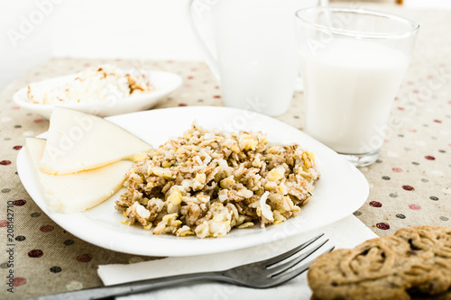 porridge from flakes of different varieties of grain, cheese photo