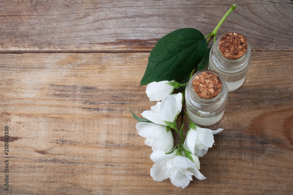 Essential oil with jasmine flower. Top view Essential oil with jasmine flower. Top view