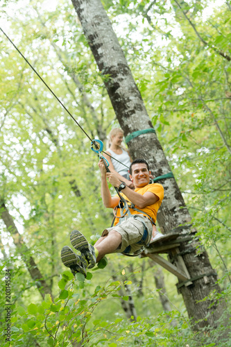 man on a difficult course in an adventure park