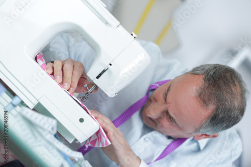 fashion designer using sewing machine