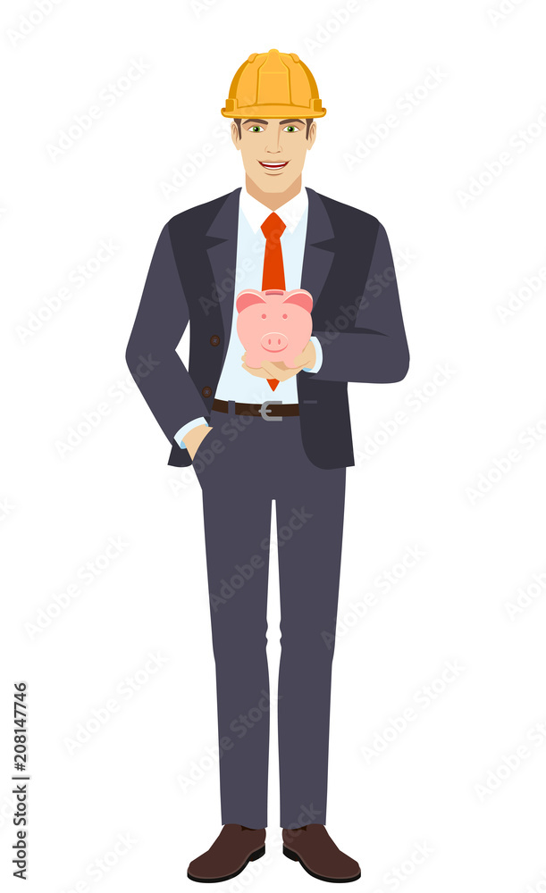 Businessman in construction helmet with hand in pocket with piggy bank