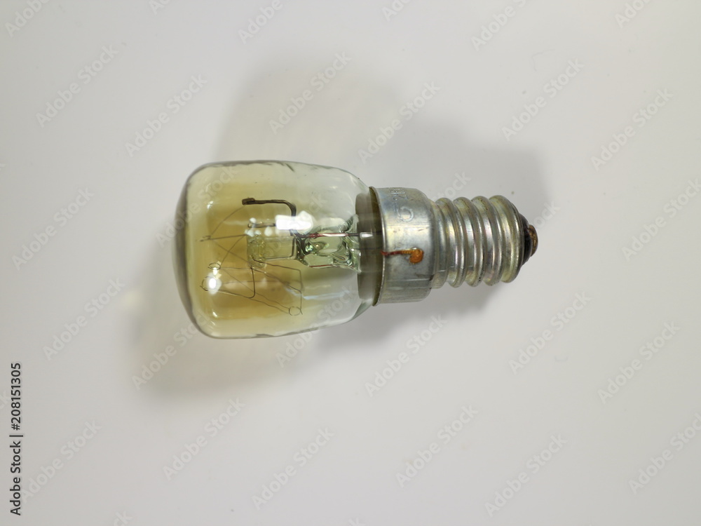electric incandescent light on white table electric incandescent light on white table