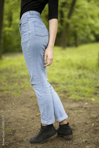 Woman buttocks in blue jeans