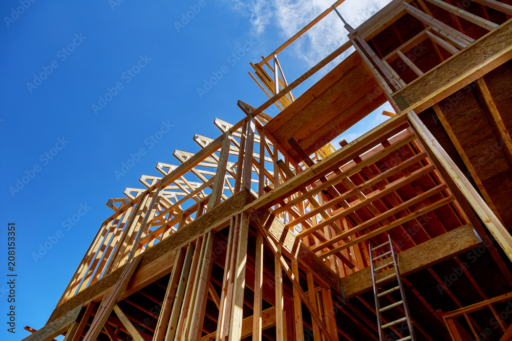 Framing of house Closeup new stick built home under construction under blue sky construction and real estate