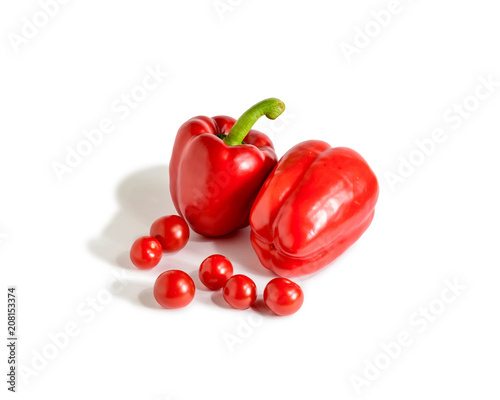 Red bell paprika pepper, isolated on a white background with cherry tomato