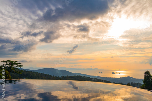 View of the ocean and nearby islands with a swimming pool in the foreground before sunset  Koh Samui  Thailand