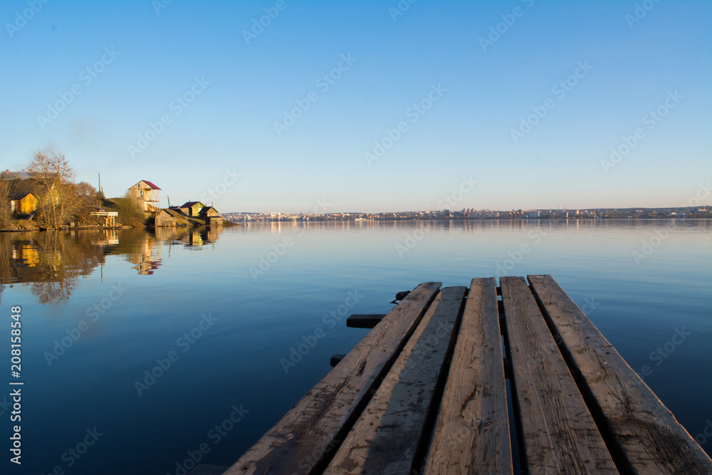 Fototapeta premium Beach with houses on the lake and pier