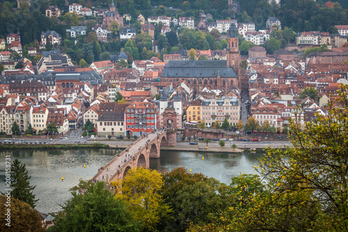 Old Bridge and Old town in Heidelberg with tourists and river Necker