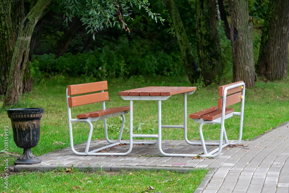 Wooden benches and table in the city park Wooden benches and table in the city park