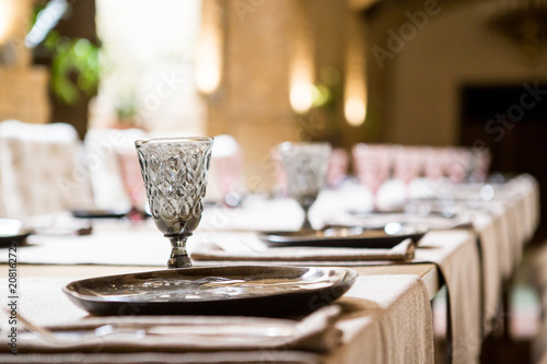 Empty glasses set in restaurant. Banquet table set