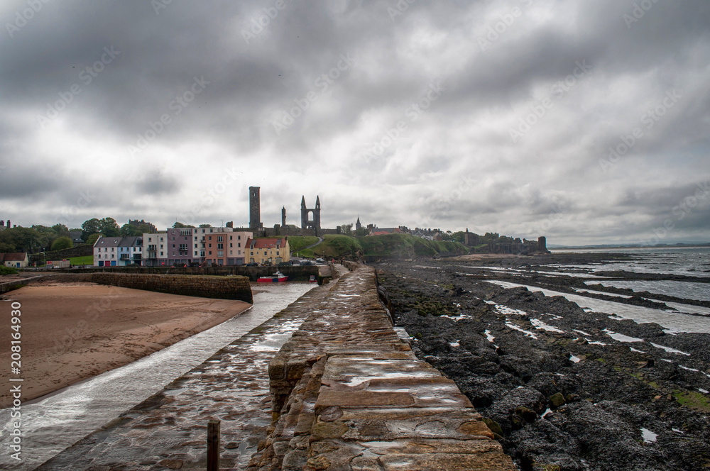 Fototapeta premium Beach, pier and sea at tide at St Andrew, Scotland