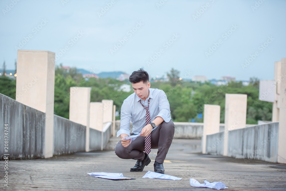 Unemployed businessman stress sitting on stair,