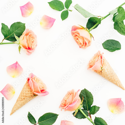 Fototapeta Naklejka Na Ścianę i Meble -  Floral frame with roses flowers, buds and waffle cones on white background. Flat lay, top view. Summer background