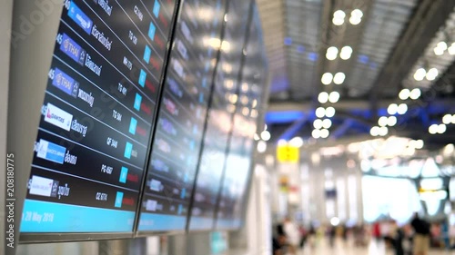 Arrival departure board in airport terminal. Digital board showing airline flight information for passengers who travel with international flight.