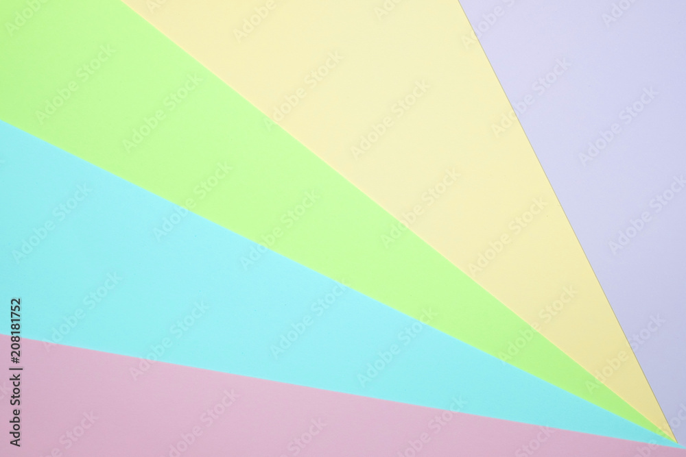 Fashionable  pastel colored paper flat lay top view, geometric background texture, pink, purple, yellow, beige, green and blue.