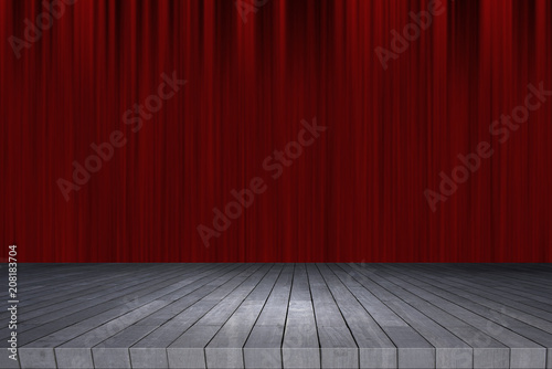 Wooden table in front of abstract blurred red curtain background.