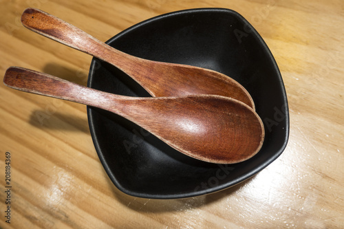 Wooden spoon and bowl photo