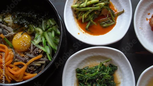 Traditional Korean Dish Bibimbap Served Along With Small Side Dishes Clled Banchan. Asian Authentic Cuisine photo